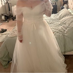 Unused wedding dress, decided on beach wedding so I bought something else.